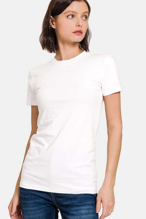 Woman wearing a white crew neck short sleeve t-shirt with jeans, showcasing a versatile and classic design for casual wear.