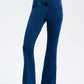 Model showcasing Basic Bae Bootcut Jeans in blue, highlighting stretchy fabric and stylish pocketed design.