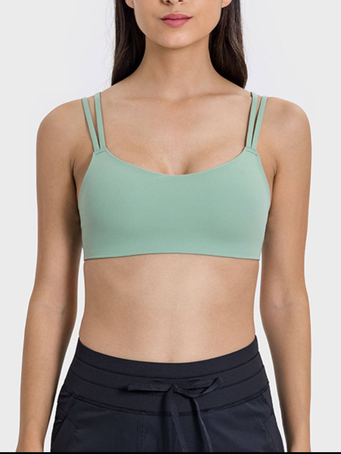 Stylish mint green active cami with double straps, perfect for workouts or casual wear, showcasing a playful design.