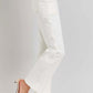 White high-rise ankle flare jeans with patch pockets and chic silhouette, paired with beige heels for a retro and flattering look.