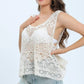 Bella Road white lace sleeveless cover up on model, showcasing elegant beach style with casual shorts.