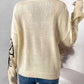 Woman wearing Perfee Mock Neck Dropped Shoulder Long Sleeve Sweater in white, showcasing back view.