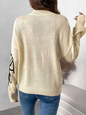 Woman wearing Perfee Mock Neck Dropped Shoulder Long Sleeve Sweater in white, showcasing back view.