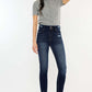 Woman wearing Cat's Whiskers Raw Hem High Waist Jeans with grey top and black flats, showcasing the edgy vintage-inspired style.