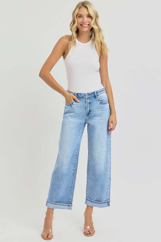 Model wearing RISEN full size ankle wide leg cuffed jeans paired with a fitted white tank top.