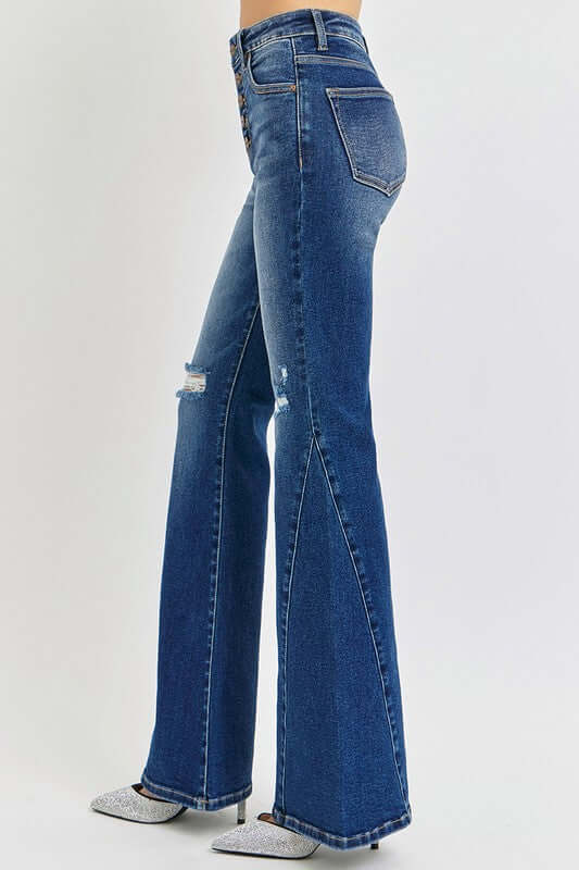 Side view of RISEN Distressed Button-Fly Flare Jeans featuring ripped design and flared leg, perfect for casual stylish outfits.