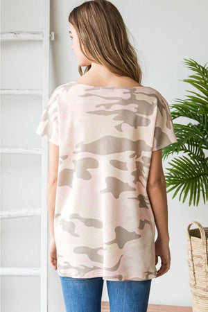 Woman wearing a short sleeve camouflage tunic T-shirt with a round neck, viewed from the back.