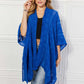 JUSTIN TAYLOR Pom-Pom Asymmetrical Poncho Cardigan in Blue at Bella Road