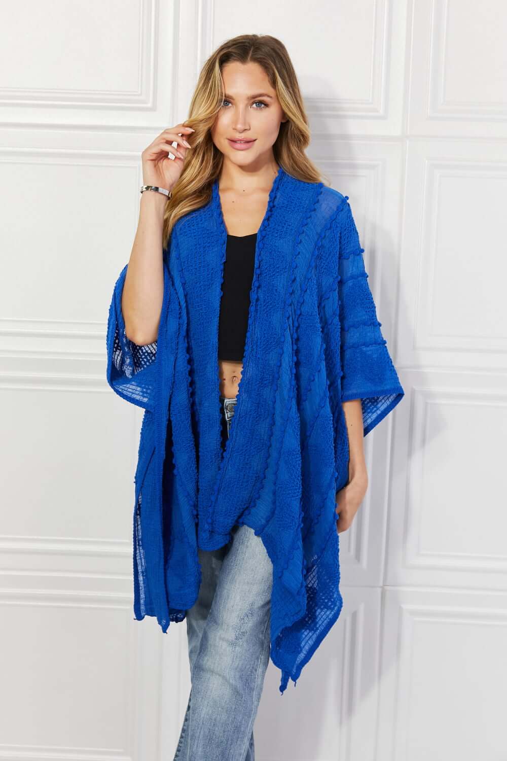 JUSTIN TAYLOR Pom-Pom Asymmetrical Poncho Cardigan in Blue at Bella Road