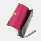 Nicole Lee USA handbag clutch with pink interior and wristlet strap open to show inner compartment