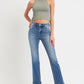 Woman wearing RISEN full size mid rise ankle straight jeans with pockets, stylish denim with a chic and versatile look