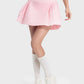 Fun and flirty pink pleated active skirt with mid-rise waist, perfect for stylish workouts and everyday wear.