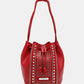 Nicole Lee USA Amy Studded Bucket Bag in red vegan leather with drawstring closure and stud detailing. Stylish and durable fashion accessory.