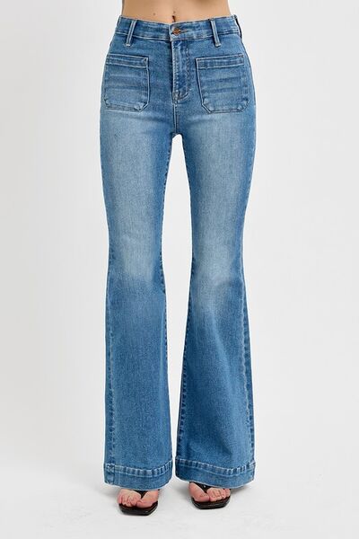 Flare jeans with front patch pockets, featuring a retro-inspired design and slightly stretchy material.