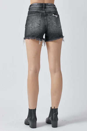 Back view of High Rise Distressed Denim Shorts showcasing edgy detailing and raw hem, perfect for a trendy summer look. Risen Jeans.