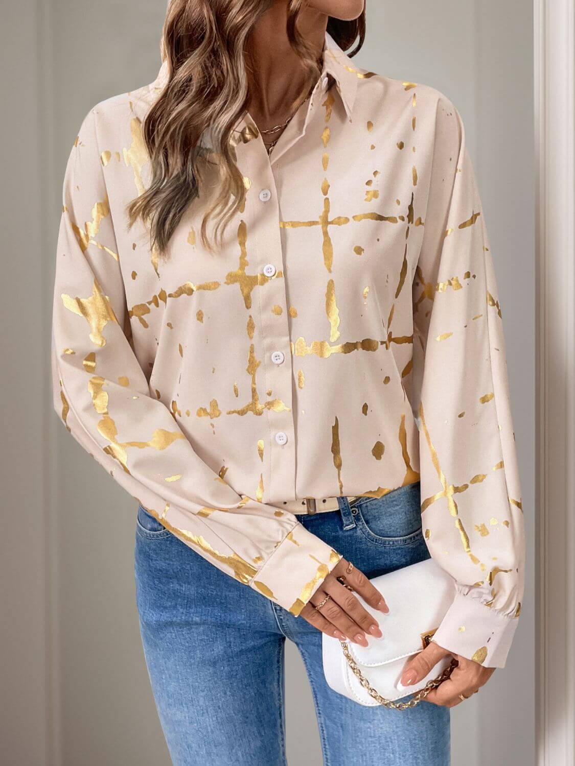 Woman wearing Perfee Printed Collared Neck Long Sleeve Shirt with gold accents, exuding elegance and style.