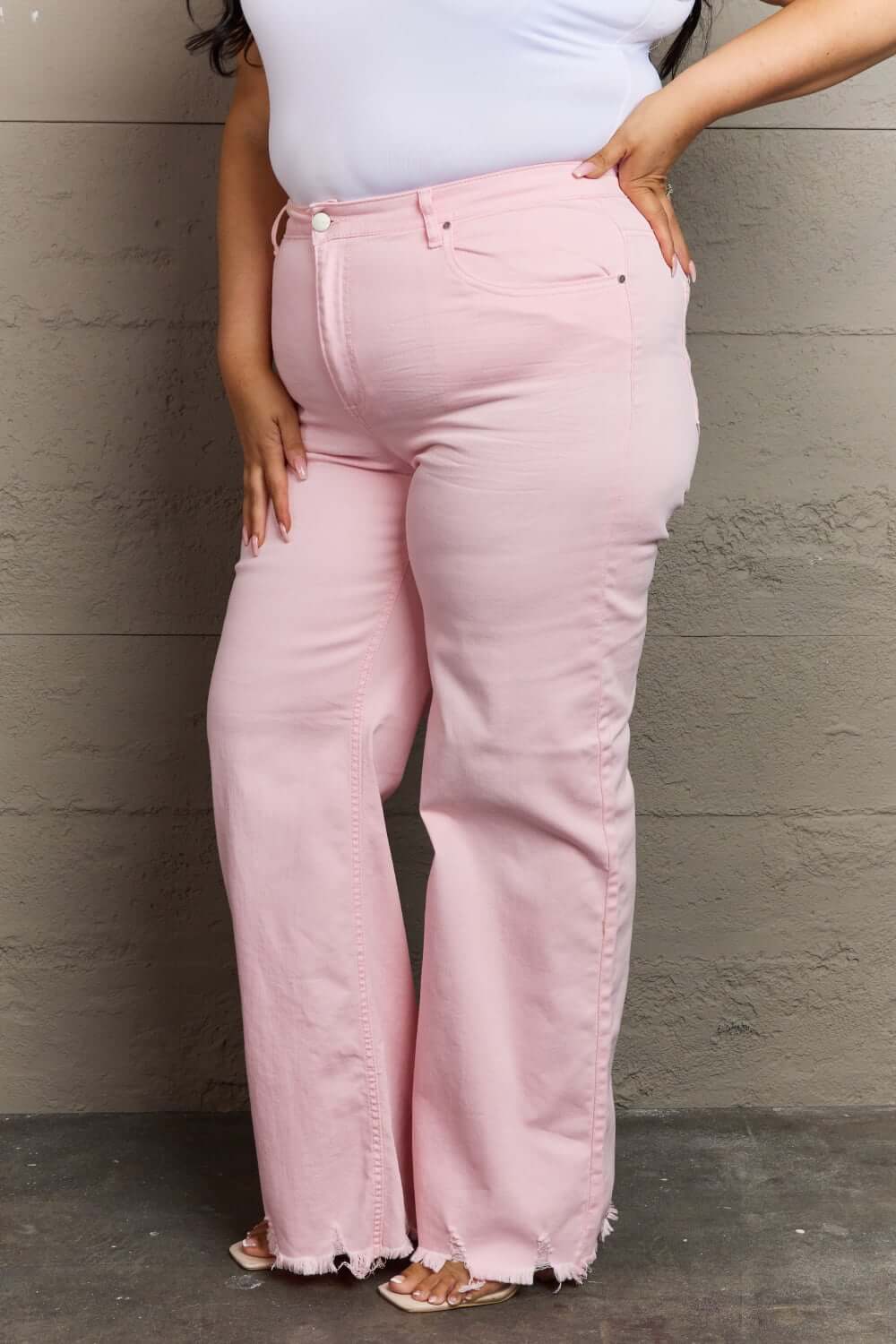 Raelene High Waist Wide Leg Jeans in light pink by Risen Jeans, showcasing flattering fit and retro flair on various body types