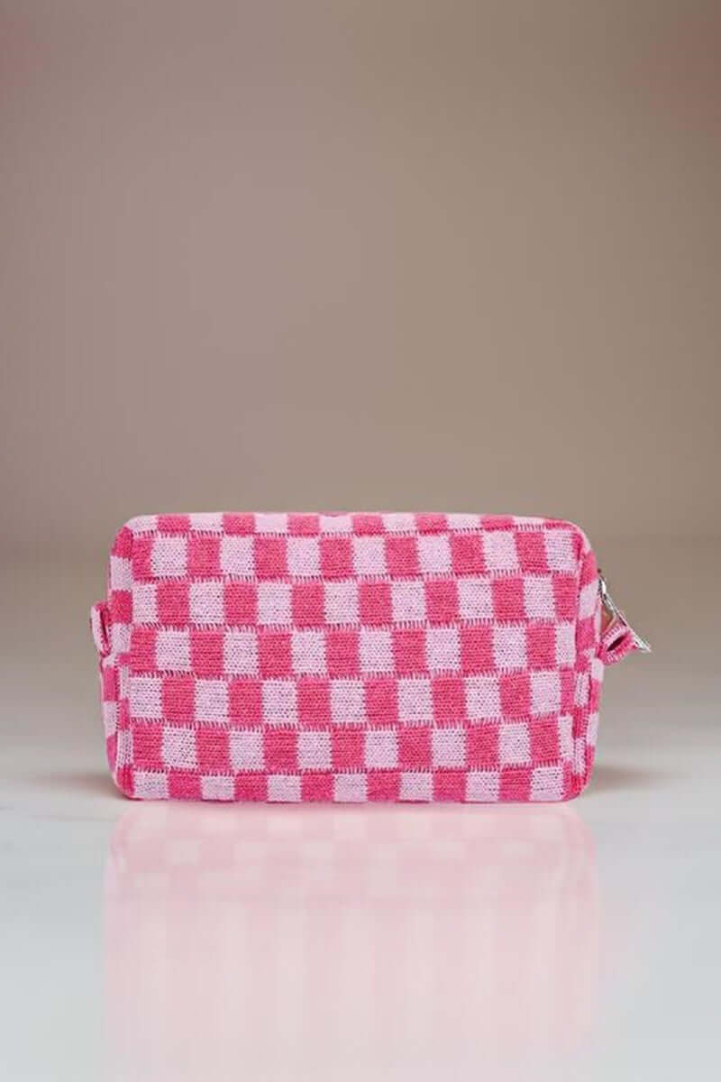 Stylish pink checkered pattern knitted cosmetic pouch with zipper closure, perfect for organizing beauty essentials.