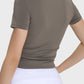 Back view of Millennia Ruched Round Neck Short Sleeve Active T-Shirt in mocha, showcasing its stylish and fitted design.