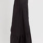 Side view of RISEN Shirring Detail Wide Leg Pants, showcasing their flowing silhouette and stylish shirring details.