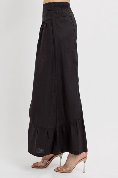 Side view of RISEN Shirring Detail Wide Leg Pants, showcasing their flowing silhouette and stylish shirring details.