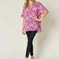 DOUBLE TAKE Full Size Printed V-Neck Short Sleeve Blouse at Bella Road