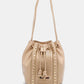 Nicole Lee USA Amy Studded Bucket Bag in pebbled vegan leather with studded details and drawstring closure.