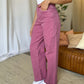 High Rise Garment Dye Wide Leg Jeans in pink paired with a white top, showcasing a relaxed fit and stylish high-waist design