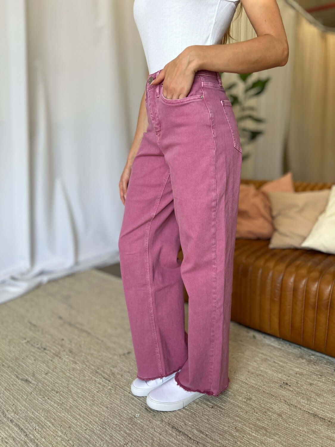 High Rise Garment Dye Wide Leg Jeans in pink paired with a white top, showcasing a relaxed fit and stylish high-waist design