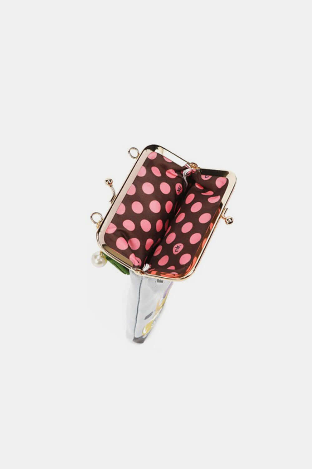 Inside view of Nicole Lee USA Printed Kisslock Phone and Sunglass Purse with polka dot interior lining.