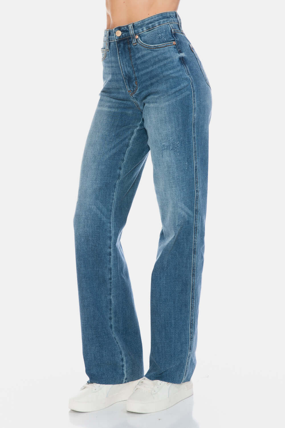 Stylish Judy Blue tummy control raw hem straight jeans with high-waist for a flattering silhouette and trendy casual look.