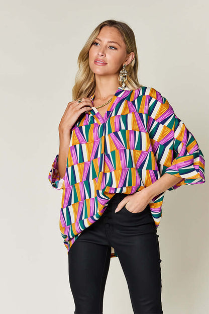 DOUBLE TAKE Full Size Geometric Notched Raglan Sleeve Blouse at Bella Road