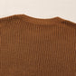 Close-up of Bella Road Pearl Detail Sweater in brown, showcasing the intricate knit texture and classic round neck.