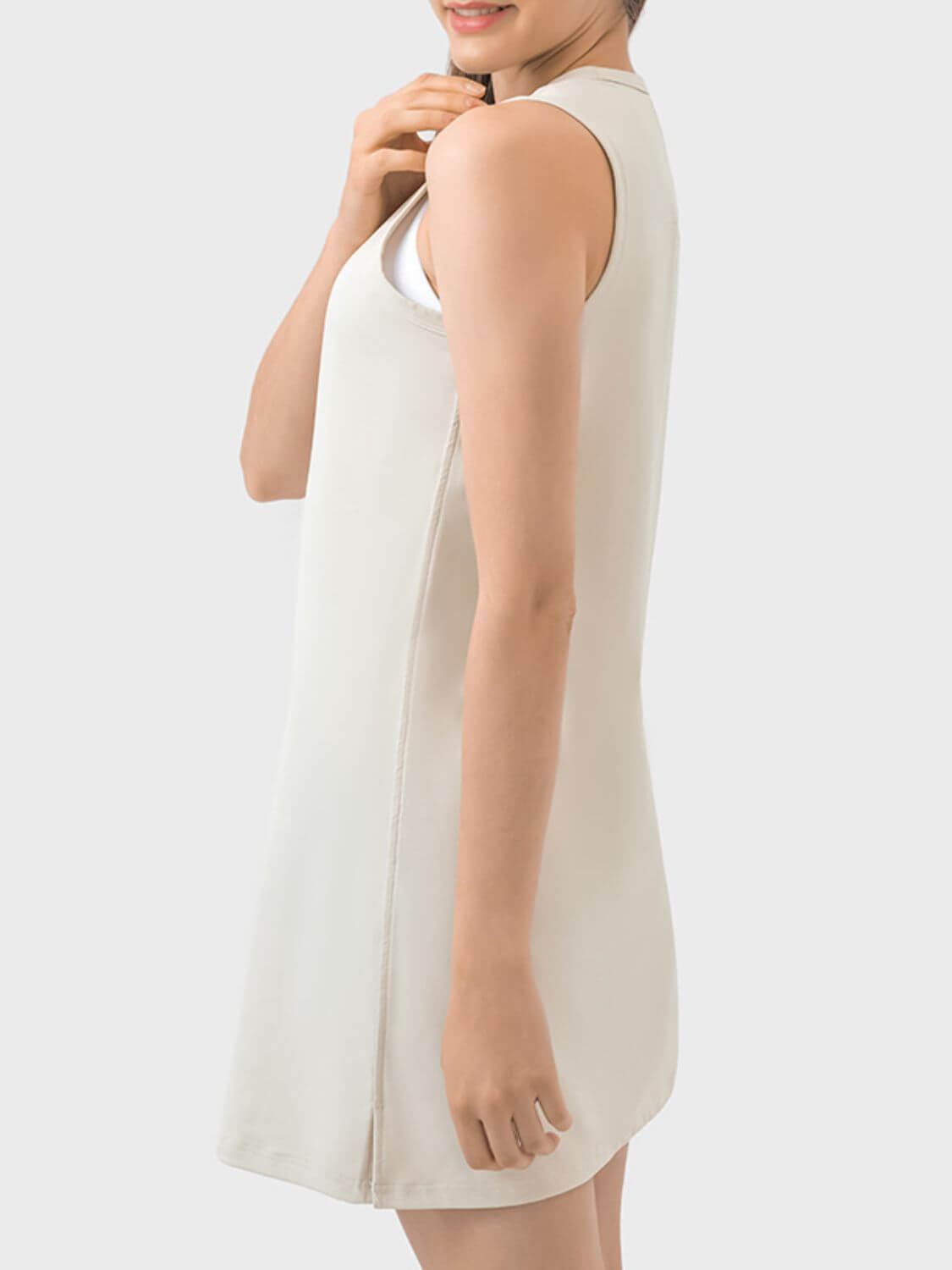 Millennia Round Neck Sleeveless Active Dress in beige, showcasing a stylish and comfortable design for workouts.