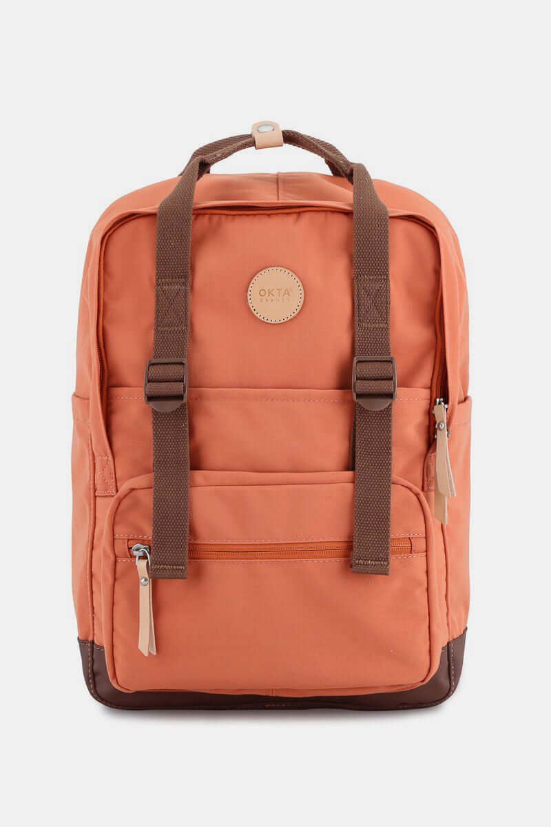 Stylish orange waterproof canvas backpack with front and side pockets, perfect for adventures.