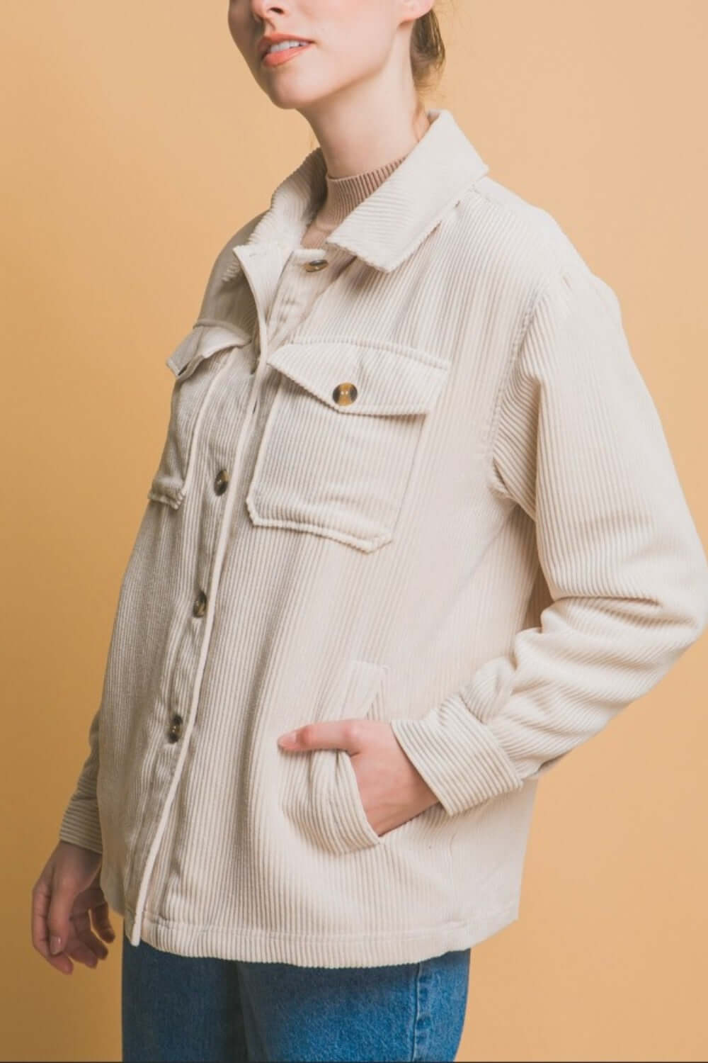 Woman wearing a Love Tree Corduroy Button Up Jacket with cozy sherpa lining in a stylish, relaxed fit.