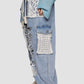 Trendy crochet patch distressed washed jeans with floral details and a relaxed fit for bohemian-style outfits.