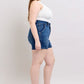 Side view of Judy Blue plus size double button waistband denim shorts showcasing a flattering high-waisted fit.