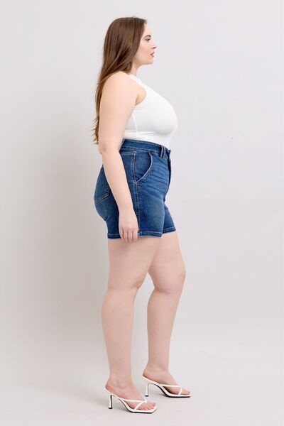 Side view of Judy Blue plus size double button waistband denim shorts showcasing a flattering high-waisted fit.