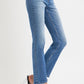 Mid Rise Ankle Straight Jeans with Pockets styled with heels, featuring a chic straight leg and classic denim look.