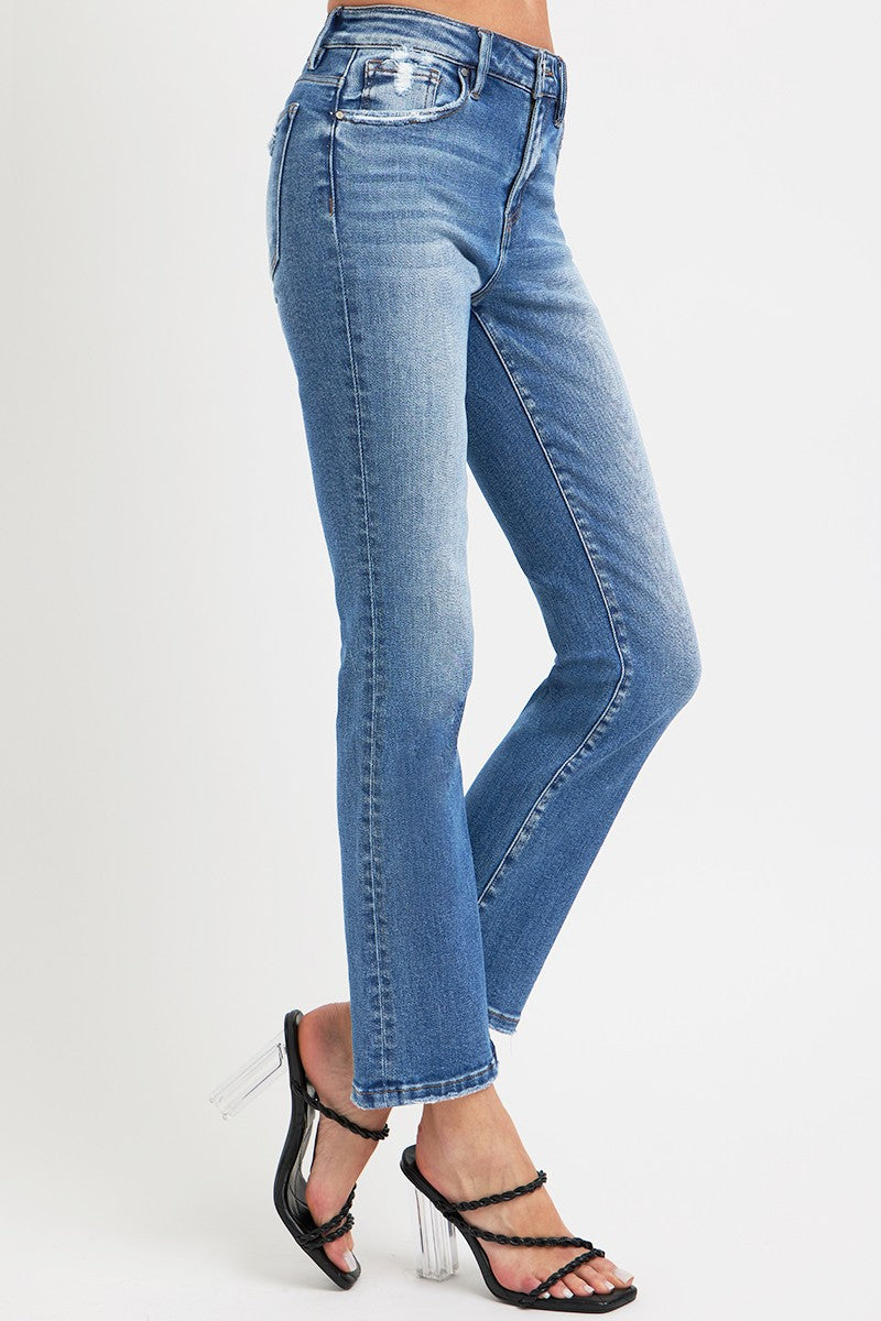 Mid Rise Ankle Straight Jeans with Pockets styled with heels, featuring a chic straight leg and classic denim look.