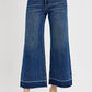 Plus size high rise crop wide hem jeans in dark denim with tummy control for a flattering fit and stylish look.