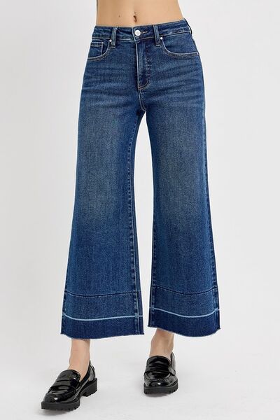 Plus size high rise crop wide hem jeans in dark denim with tummy control for a flattering fit and stylish look.