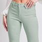 Woman wearing mint green Hyperstretch Mid-Rise Skinny Jeans by YMI Jeans, showcasing a flattering and comfortable fit.