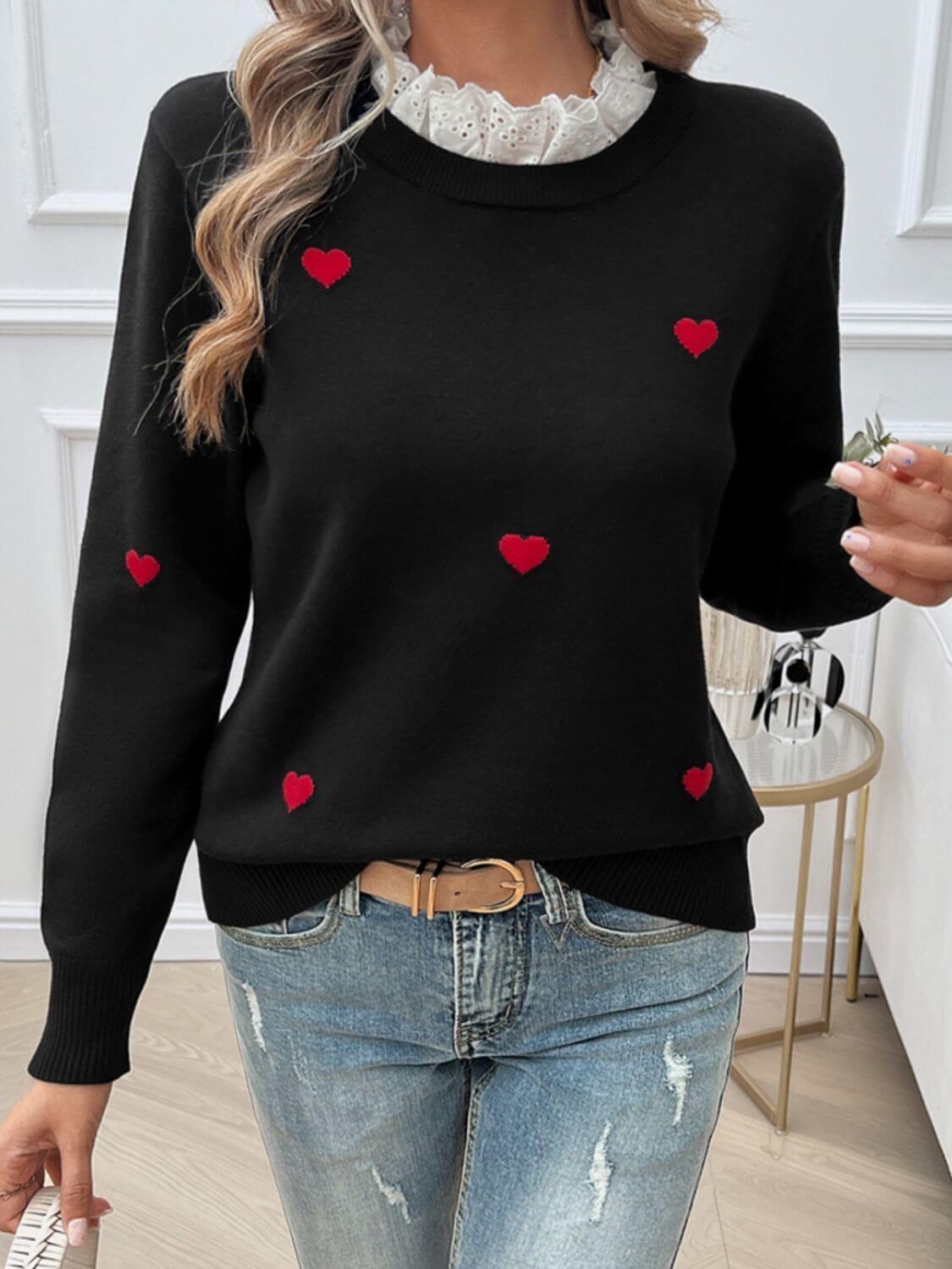 Woman wearing Devine Lace Detail Heart Long Sleeve Sweater with red heart details, perfect for cozy and romantic occasions.