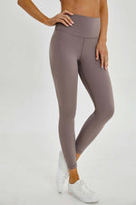 Millennia wide seamless band waist sports leggings in a stylish taupe color, perfect for workouts and everyday movement.