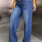 Woman wearing stylish wide leg jeans with pockets, showcasing comfortable and fashion-forward denim.