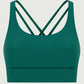 Millennia Crisscross Scoop Neck Active Tank in rich green, featuring stylish crisscross design for ultimate comfort and style.