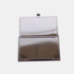 Open metallic business card case by Nicole Lee USA with a stainless steel back and snap closure.