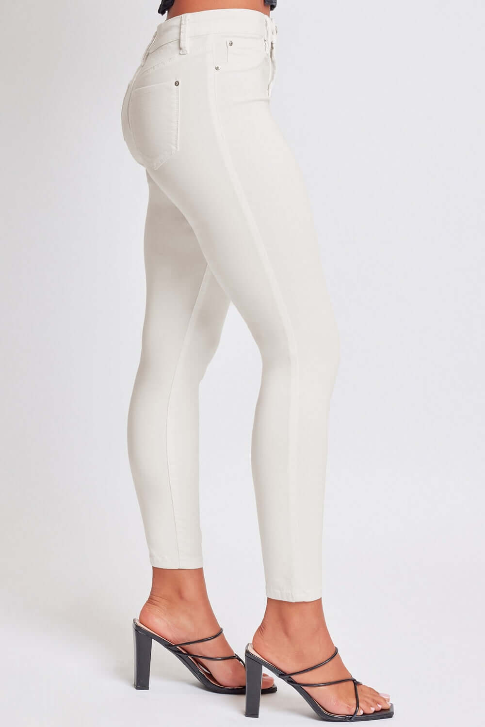 YMI Hyperstretch Mid-Rise Skinny Jeans in white, showcasing a comfortable and flattering fit with stretchy fabric for freedom of movement.